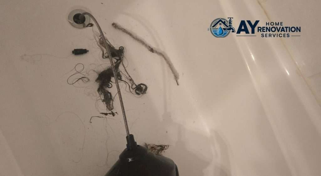 Hair pulled out of a blocked shower drain